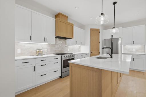 Photo of similar model - grant kitchen with quartz countertops