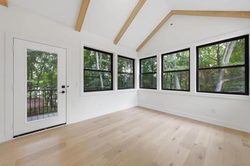 Photo of similar model - gorgeous sunroom overlooking backyard