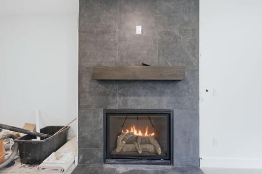 Photo of similar model - lower level fireplace