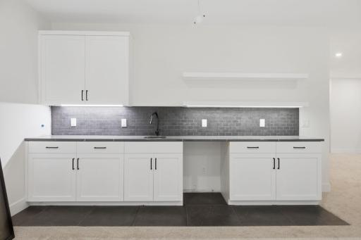 Photo of similar model - lower level wet bar area