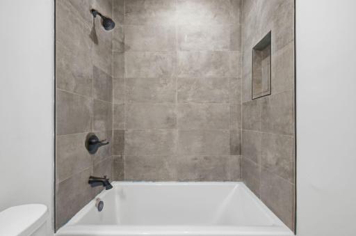 Photo of similar model - lower level bathtub