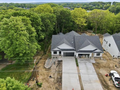 Photo of similar model - home surrounded by trees