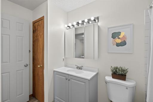 Updated main floor bath w/a linen closet for additional storage.