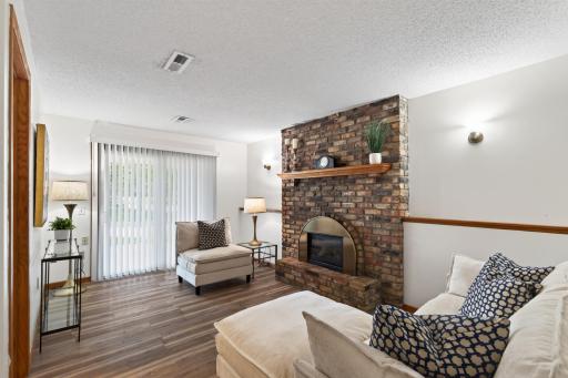 Brick surround decorative fireplace in the lower level