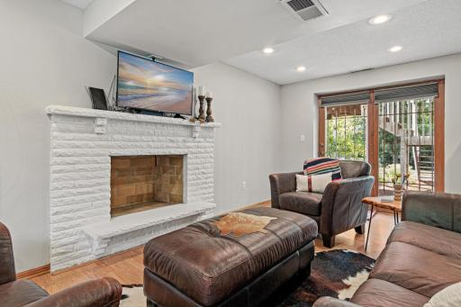 Another wonderful living and gathering space in this lower level family room with walk-out patio door