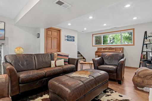 Another wonderful living and gathering space in this lower level family room with walk-out patio door