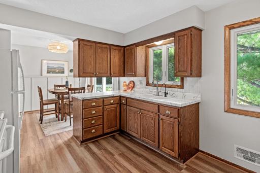 Kitchen windows overlook the spacious backyard