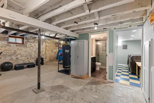 Basement with view into the laundry room and the basement 34/ bathroom.