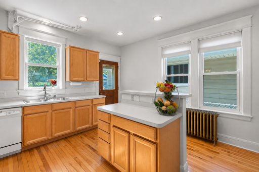 The kitchen is bright, clean and has lots of light.