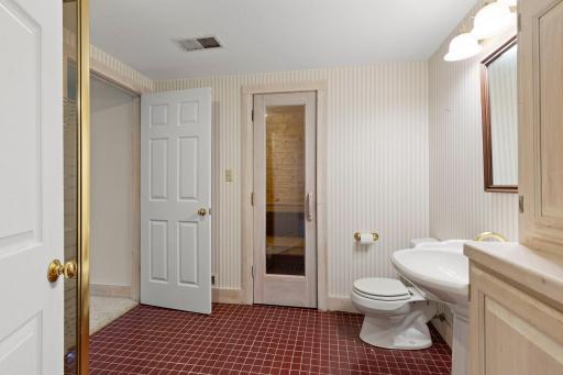Access to the sauna within the lower level bathroom.