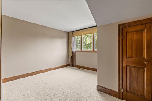 The second bedroom on this level overlooks the backyard with views over the golf course, as well as a walk-in closet.