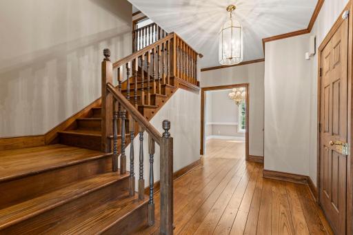 A spacious foyer and stunning woodwork and hardwood floors throughout.