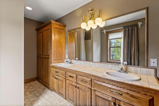 Full bathroom with a double vanity serving the upper level bedrooms.
