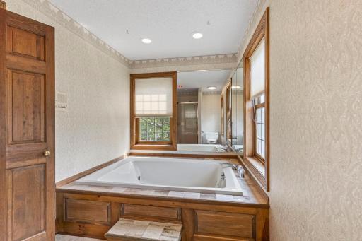 Soaking whirlpool tub overlooking the side and front yard.