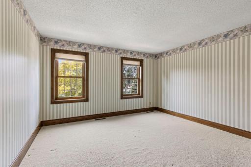 Fourth bedroom overlooks the front yard and has a spacious closet.