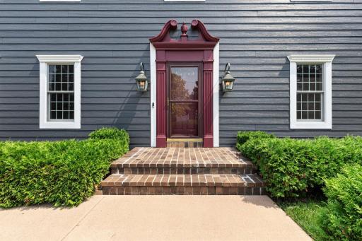 Beautiful red exterior doors infulenced by the colonial New England architecture.