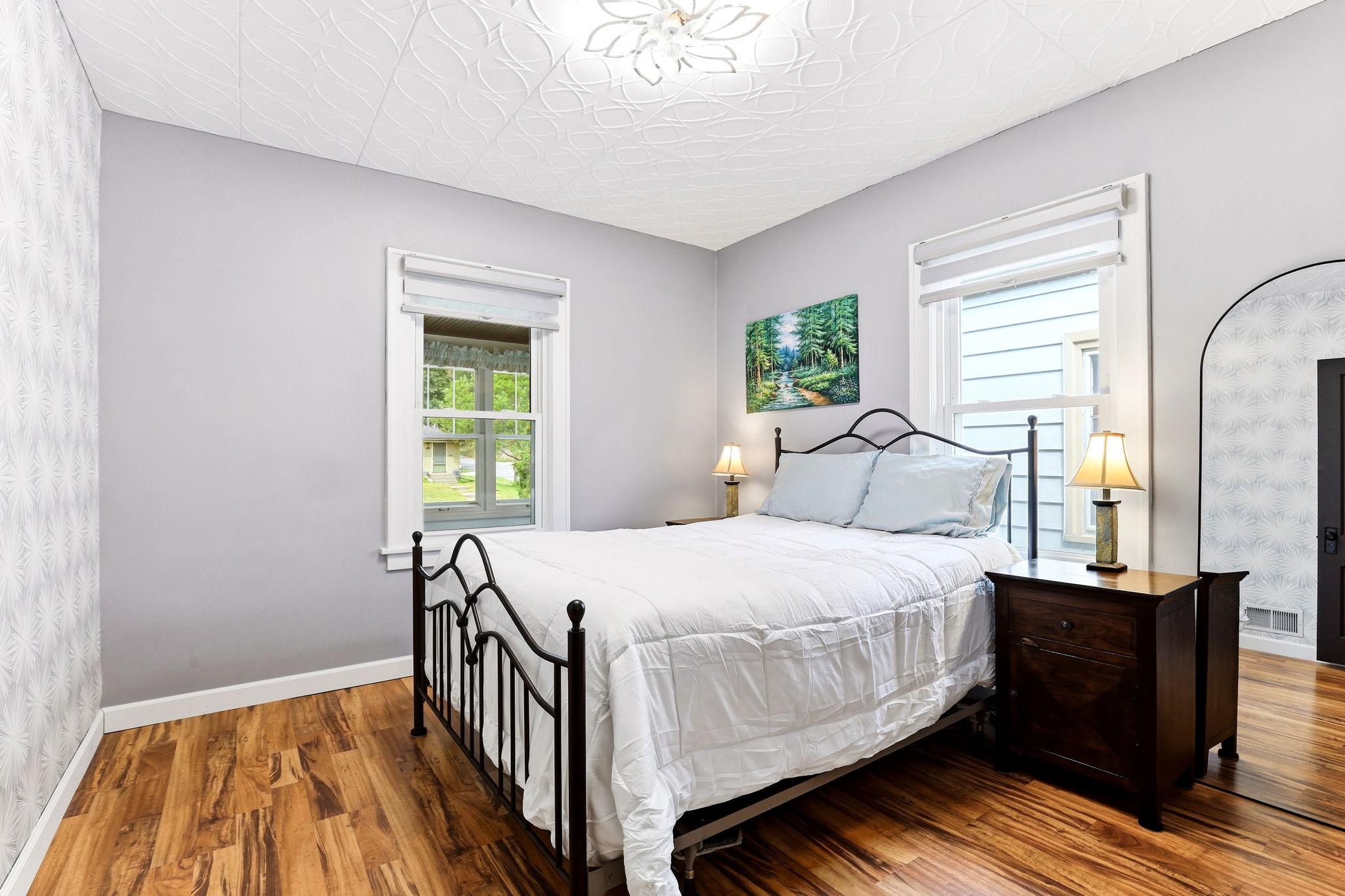 Second main-level bedroom offering flexible space for guests or daily living.