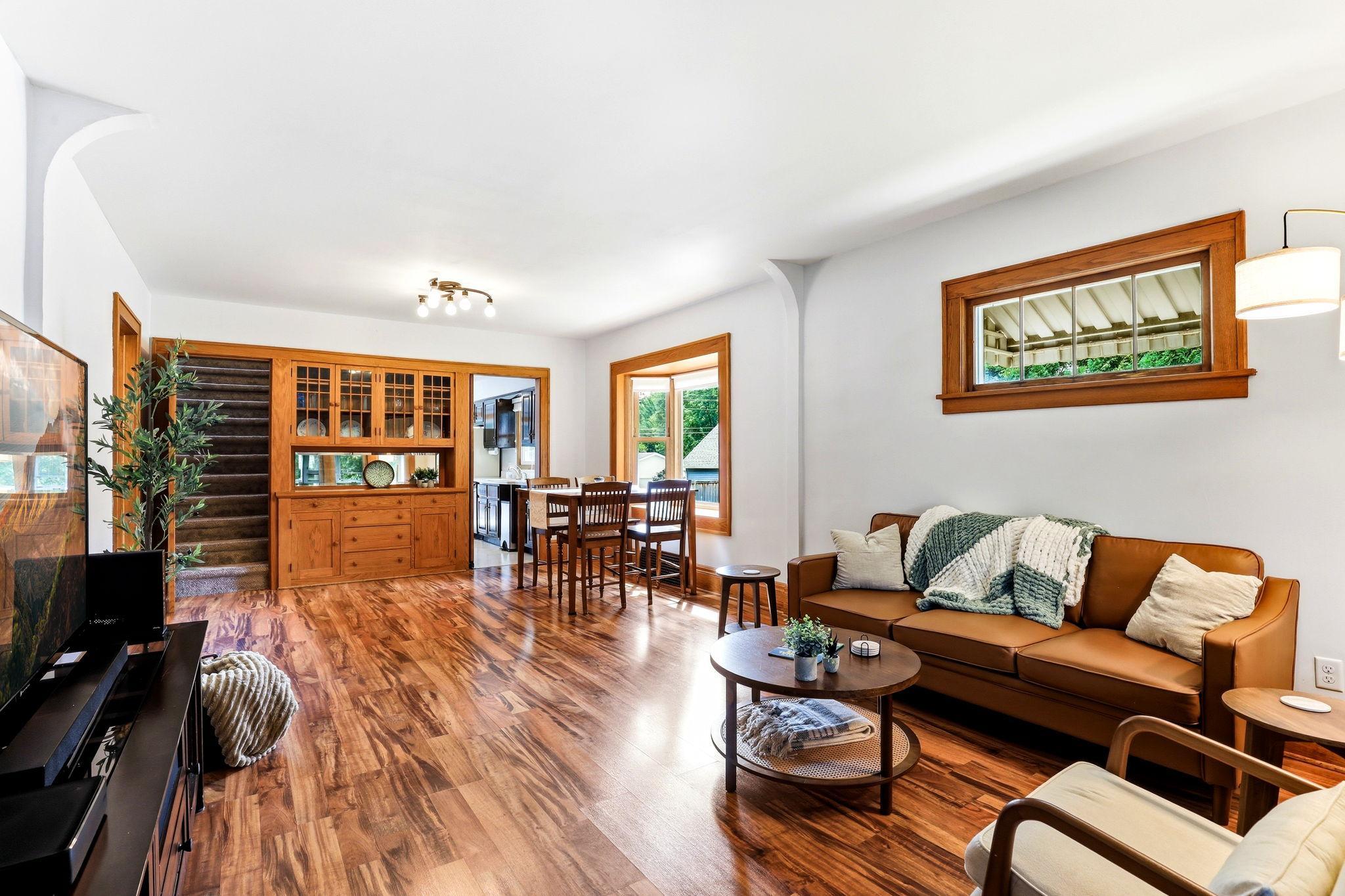 Connected living/dining space highlighted by a classic built-in buffet.