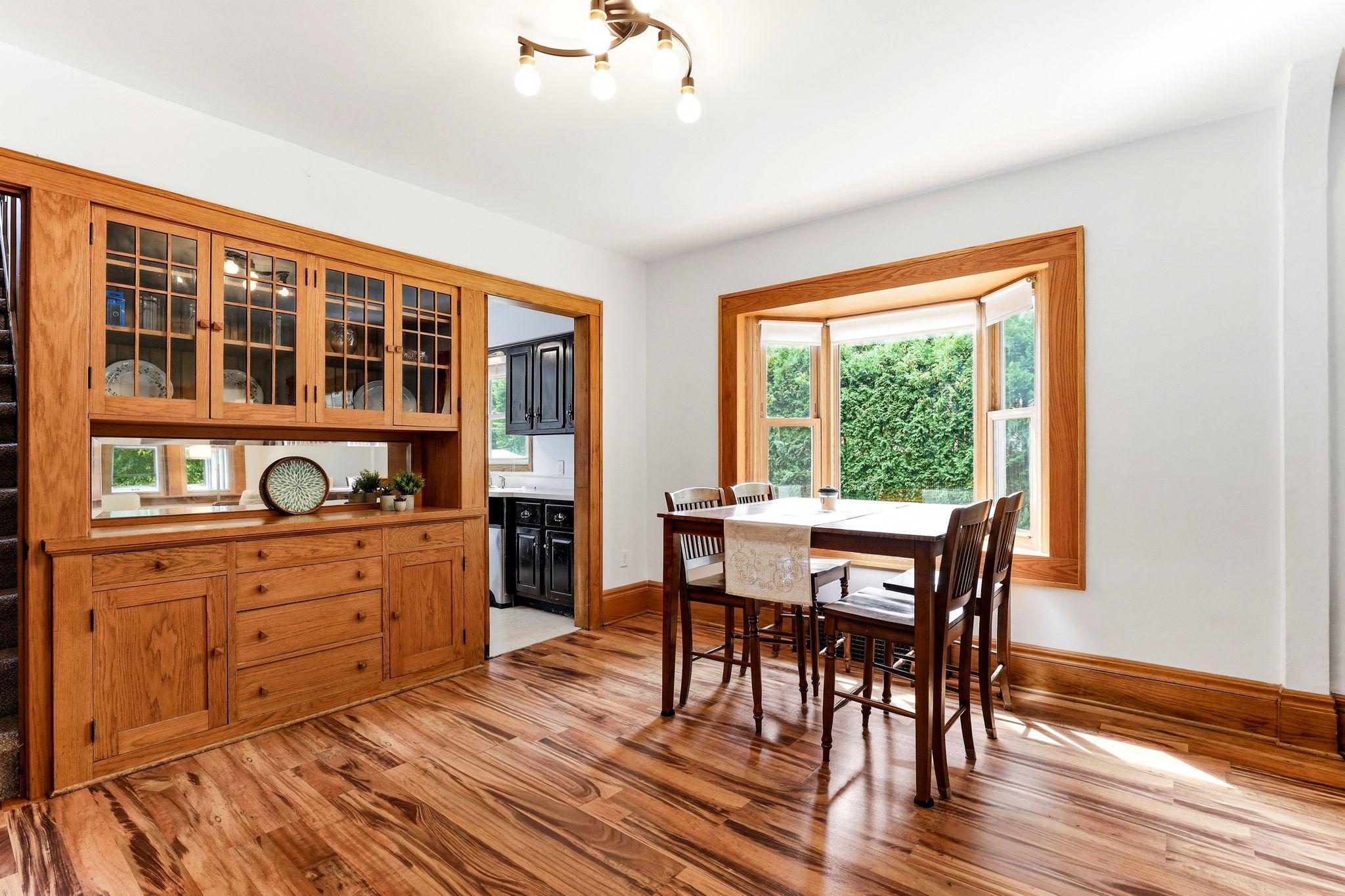 Bay window creates a sun-filled focal point in the dining room.