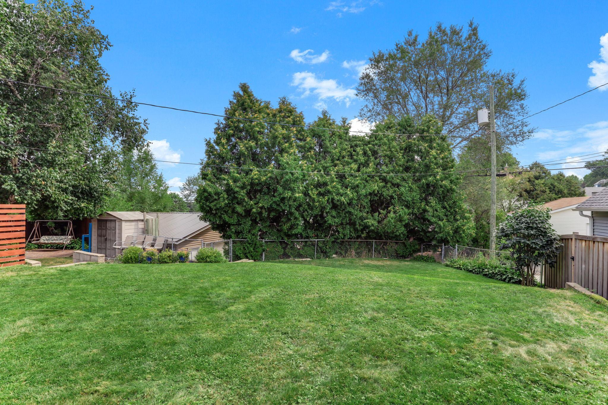 Well-maintained fenced yard providing a private, versatile outdoor area.