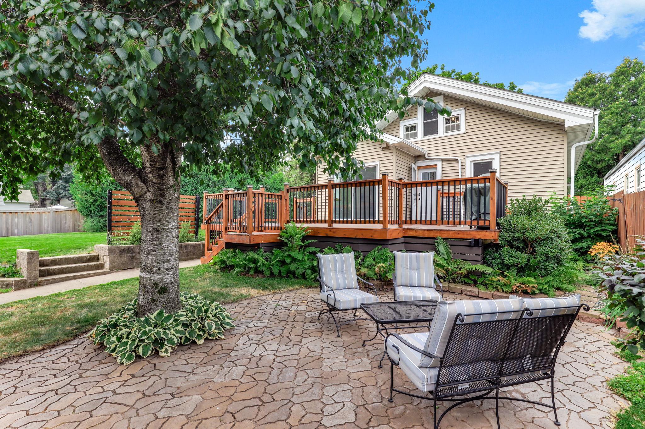 Expansive deck and stylish paver patio designed for effortless entertaining.