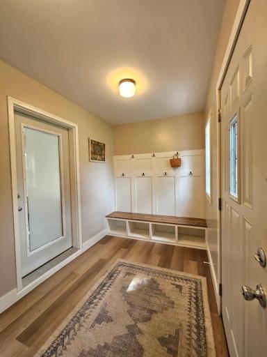 Built in bench and hooks. Note the LVP floors.