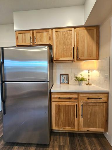 SS appliances and warm neutral wood tones!