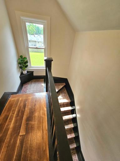 Original wood floors in landing; upper level.