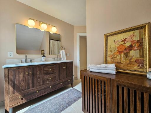 Double vanity in primary UL full bath.