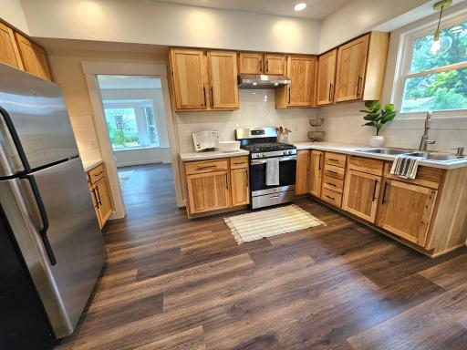 Kitchen ceiling, lighting, flooring, walls, cabinets, countertop and sink all NEW!