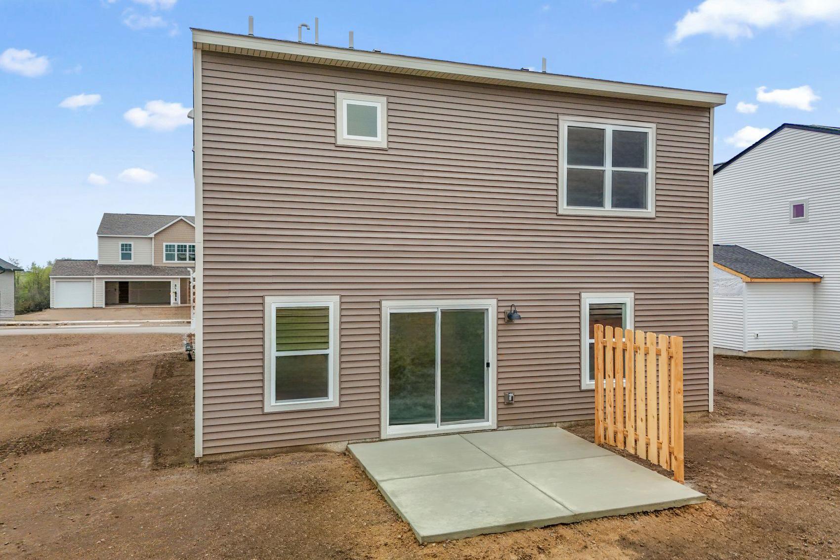 Patio, partial privacy fence, sod and irrigation included! Just add your favorite outdoor comfy chair and fire up the grill! (Picture for representation only, materials and colors may vary on actual home.)