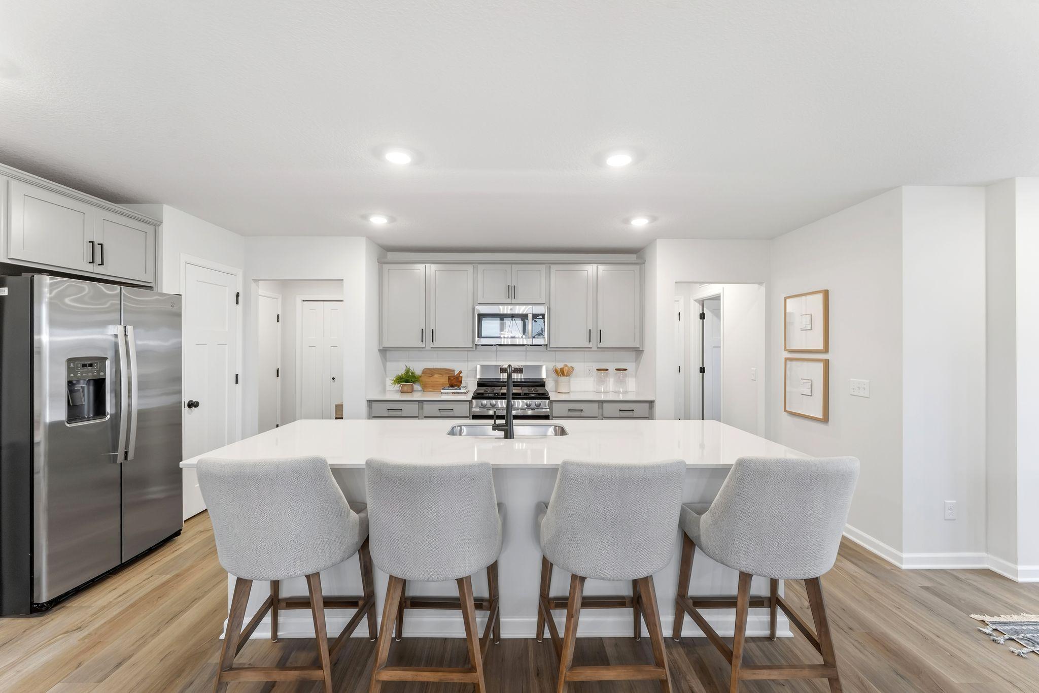 All GE stainless steel appliances are included! The microhood above the gas range vents to the exterior! Soft close doors & drawers with stylish backsplash. (Picture for representation only, colors and materials may vary in actual home.)