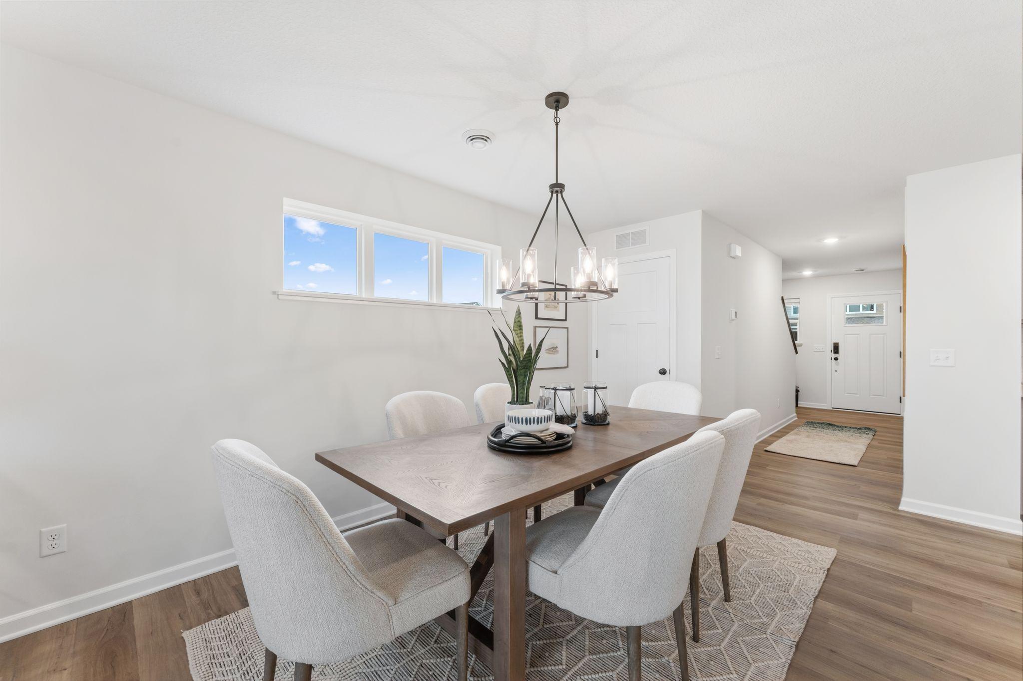 This spacious dining room is the perfect setting for any occasion & plays the perfect host to nearly any size table! (Picture for representation only, colors and materials may vary in actual home.)