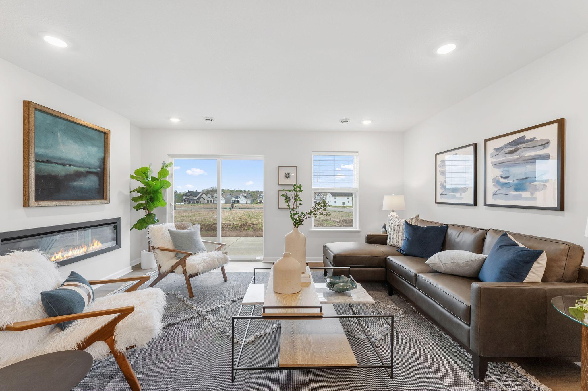 Family room walks out to patio overlooking backyard. Looking for a bit of privacy..? All functioning windows throughout the home come with blinds (excluding sliding glass patio door). (Picture for representation only, colors and materials may vary.)