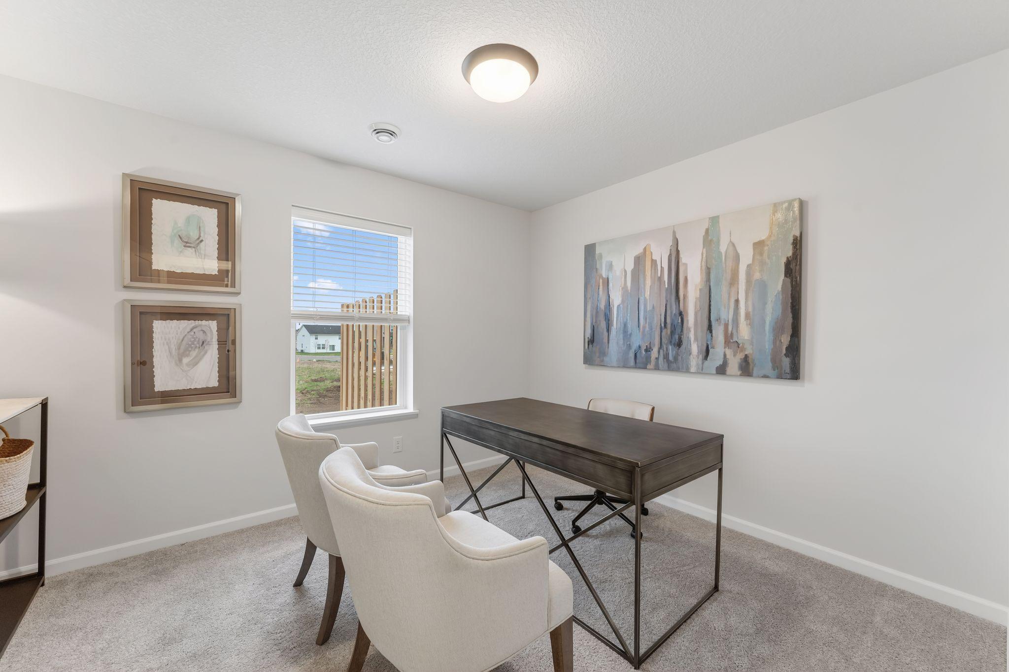 The main floor bedroom features stylish overhead lighting, a large window & ample closet space, conveniently located just steps from the 3/4 bath! (Picture for representation only, colors and materials may vary in actual home.)