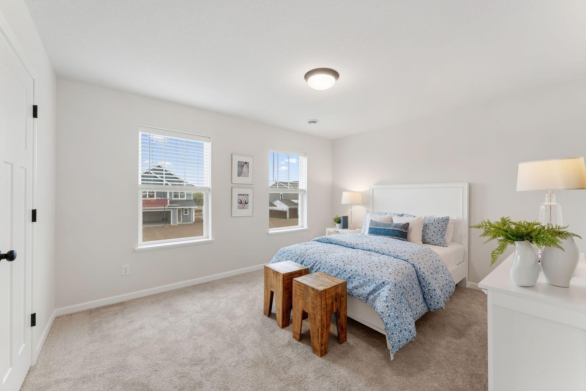Upper level bedroom 2 of 4, each of which are just steps from the full bathroom and feature ample closet space, an abundance of natural lighting & neutral plush carpeting. (Picture for representation only, colors & materials may vary in actual home.)