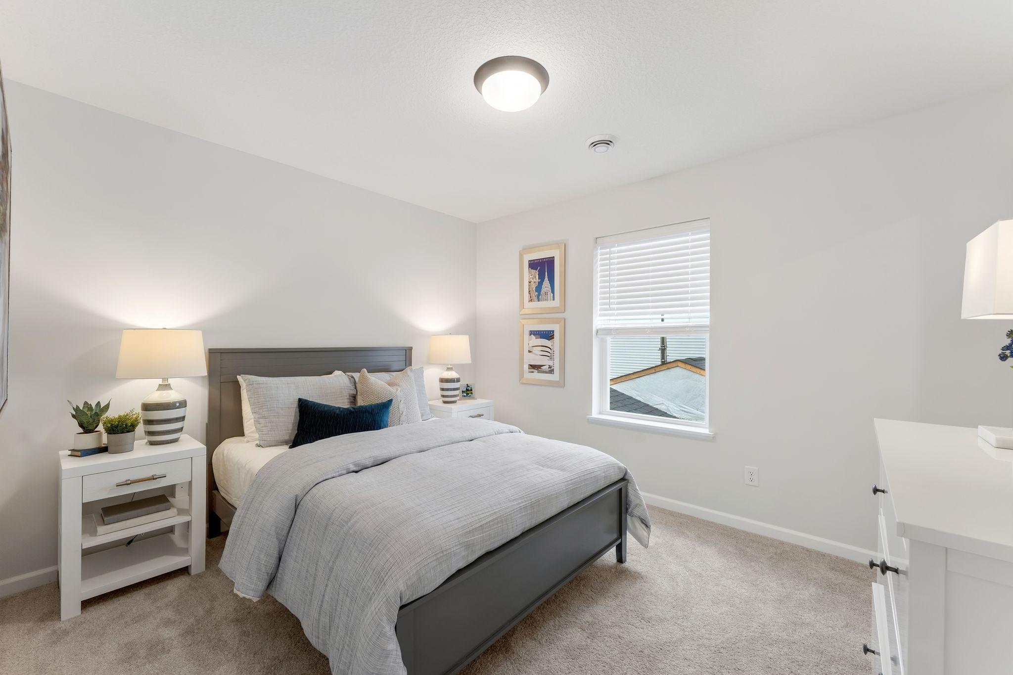 Upper level bedroom 3 of 4, each of which are conveniently located just steps from the full bathroom and feature ample closet space, an abundance of natural lighting. (Picture for representation only, colors & materials may vary in actual home.)