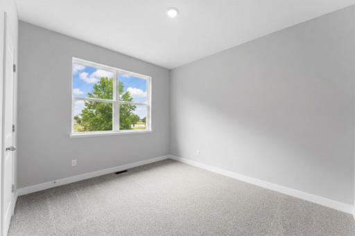 4th of 4 main level bedrooms. Photo of actual home.