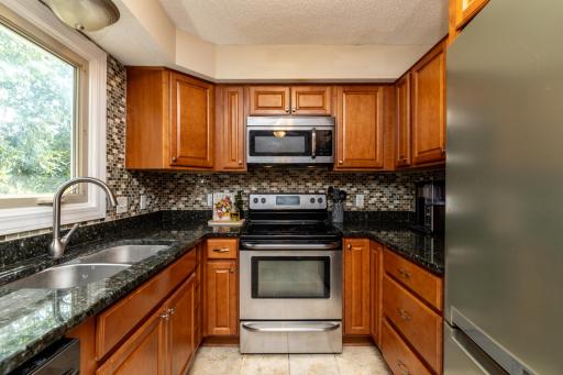 Maple Cabinets, Tile Backsplash and Plent of Counter Space