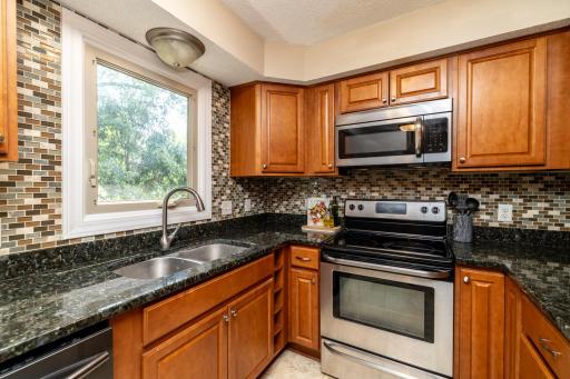 Kitchen Window Overlooking Spacious Backyard