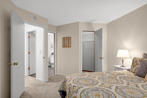 Another view highlights the bedroom’s convenient access to the bathroom and large walk-in closet.