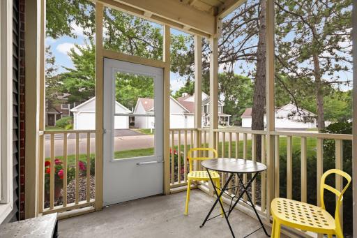 Enjoy morning coffee or an evening outside on the private covered porch, surrounded by mature trees and neighborhood views.