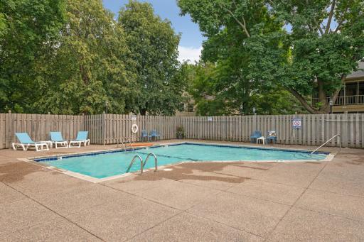 Devonwood residents can enjoy a spacious outdoor swimming pool surrounded by mature trees and seating areas.