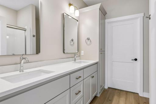 Features private bath with dual sink vanity