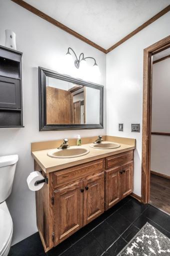Full hall bathroom on the main level has double sinks