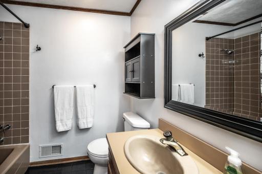 Full hall bathroom on the main level has double sinks