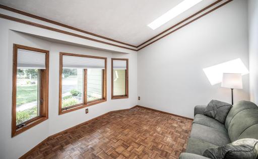 One of the two living spaces on the main level, skylights provide plenty of natural light