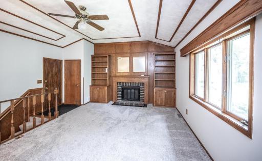 Main level living area with built-in shelving
