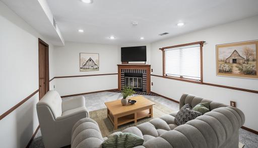 This photo has been virtually staged. Lower level family room is well-lit