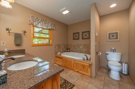 Primary bedroom ensuite bathroom with soaker tub